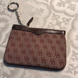 Dooney & Bourke signature coin purse in maroon.